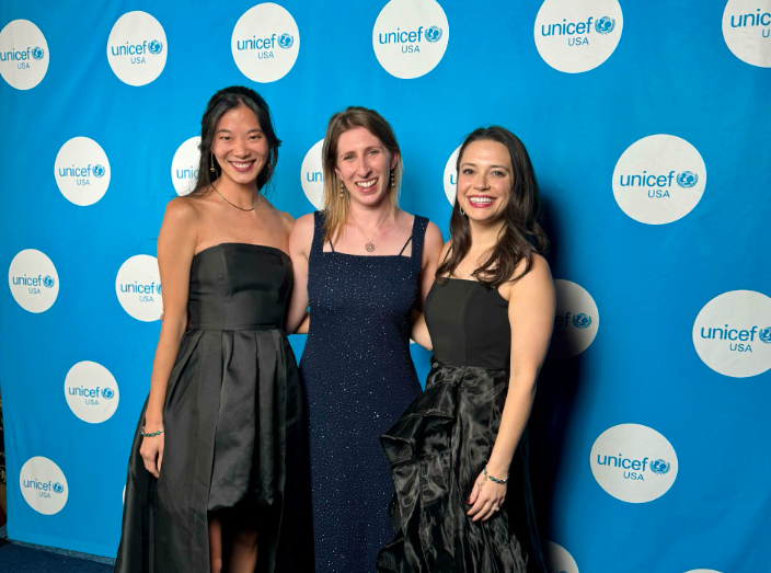 Three women in gowns at a UNICEF event