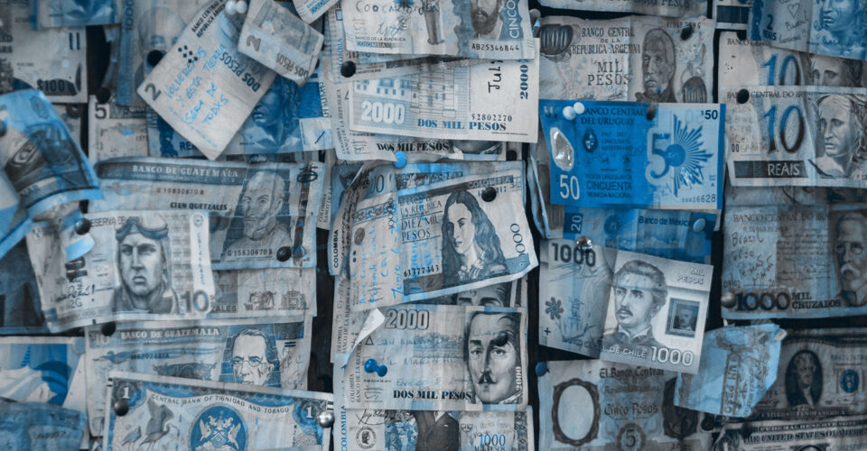 Collection of different currencies with a blue overlay