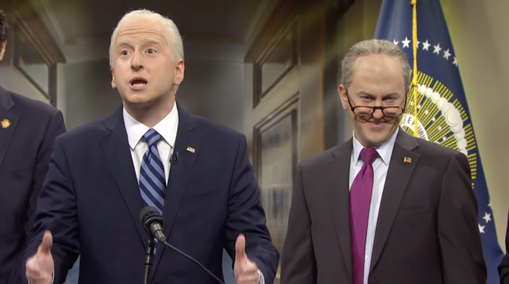 Two comedians impersonating President Joe Biden and Senator Chuck Schumer on Saturday Night Live. 
