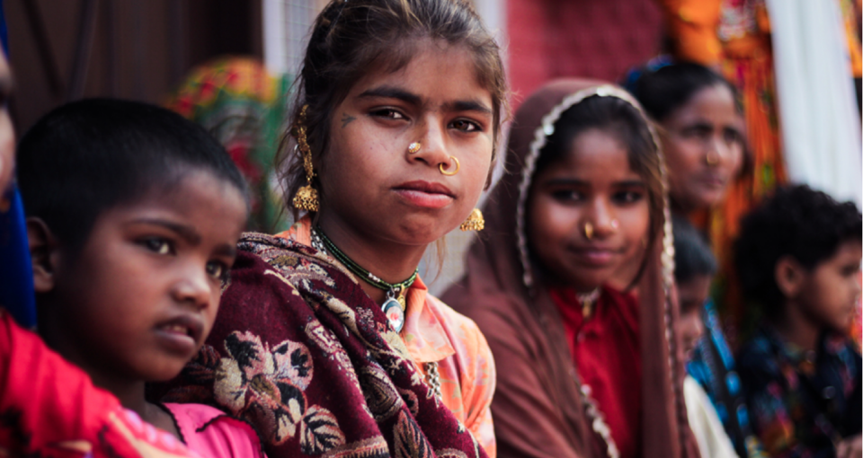 A group of young girls starting directly into camera