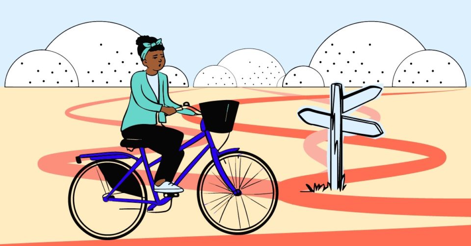 Lady riding a blue bike pausing at several crossroads